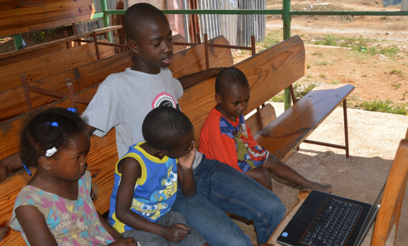 Children watch Bethel Computers for Education "Internet in a Box"